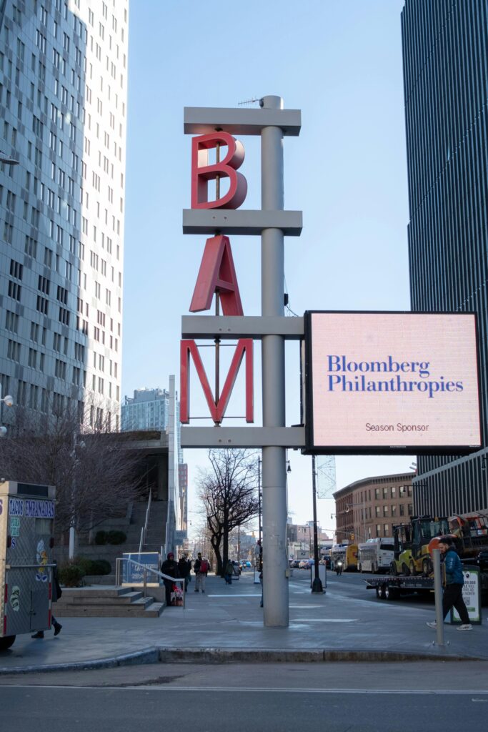 pexels-photo-29769446-29769446 Street view of BAM sign with skyscrapers in daylight setting, Brooklyn.